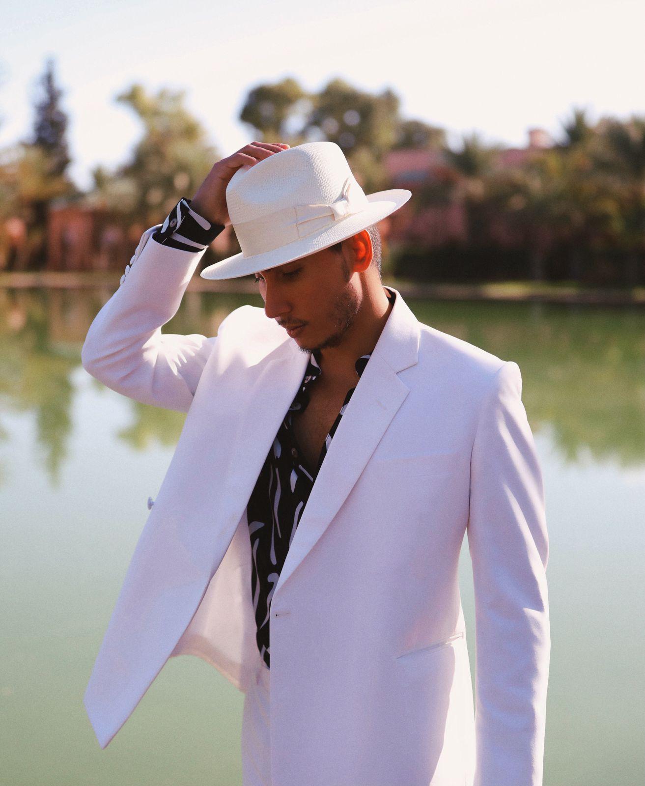 Model wearing a custom tailored pink suit from The White Stripes Tailors and Shirtmakers
