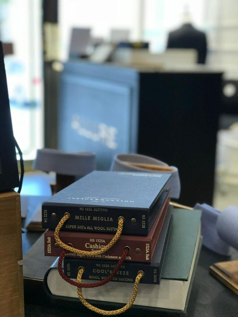 Premium suit fabric collection for bespoke tailoring at The White Stripes Tailors and Shirtmakers Dubai