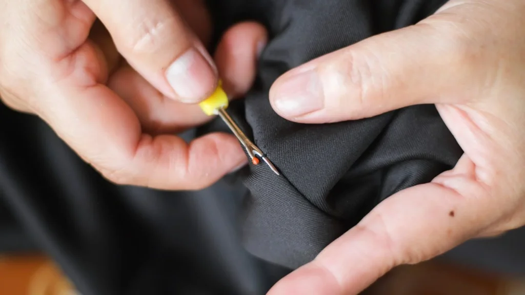 removing-temporary-suit-pocket-stitching